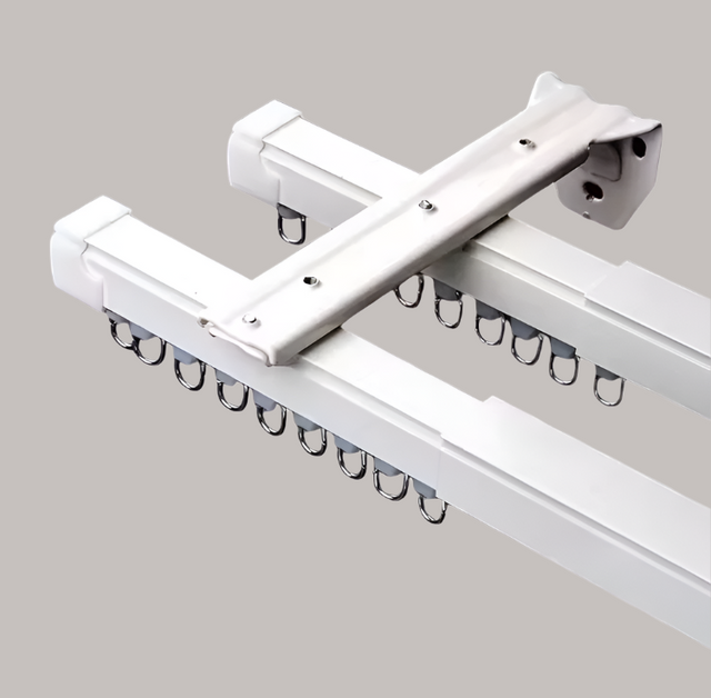 White curtain rod with brackets on a white background
