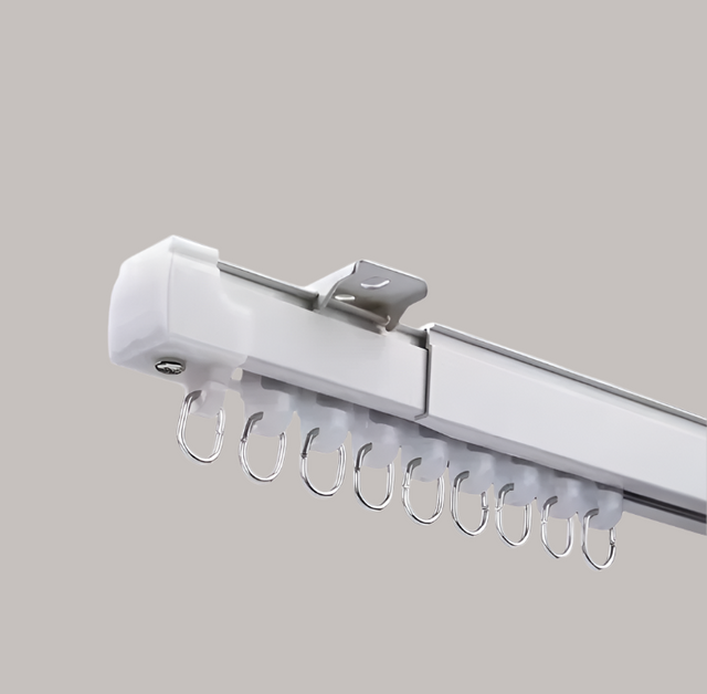 Curtain rod with hooks on a gray background